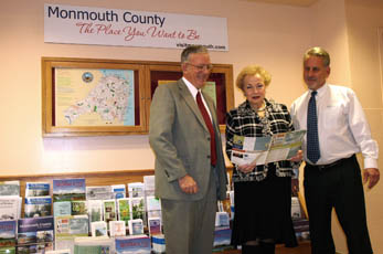 Freeholders look over newsletter at the information station at Monmouth Mall